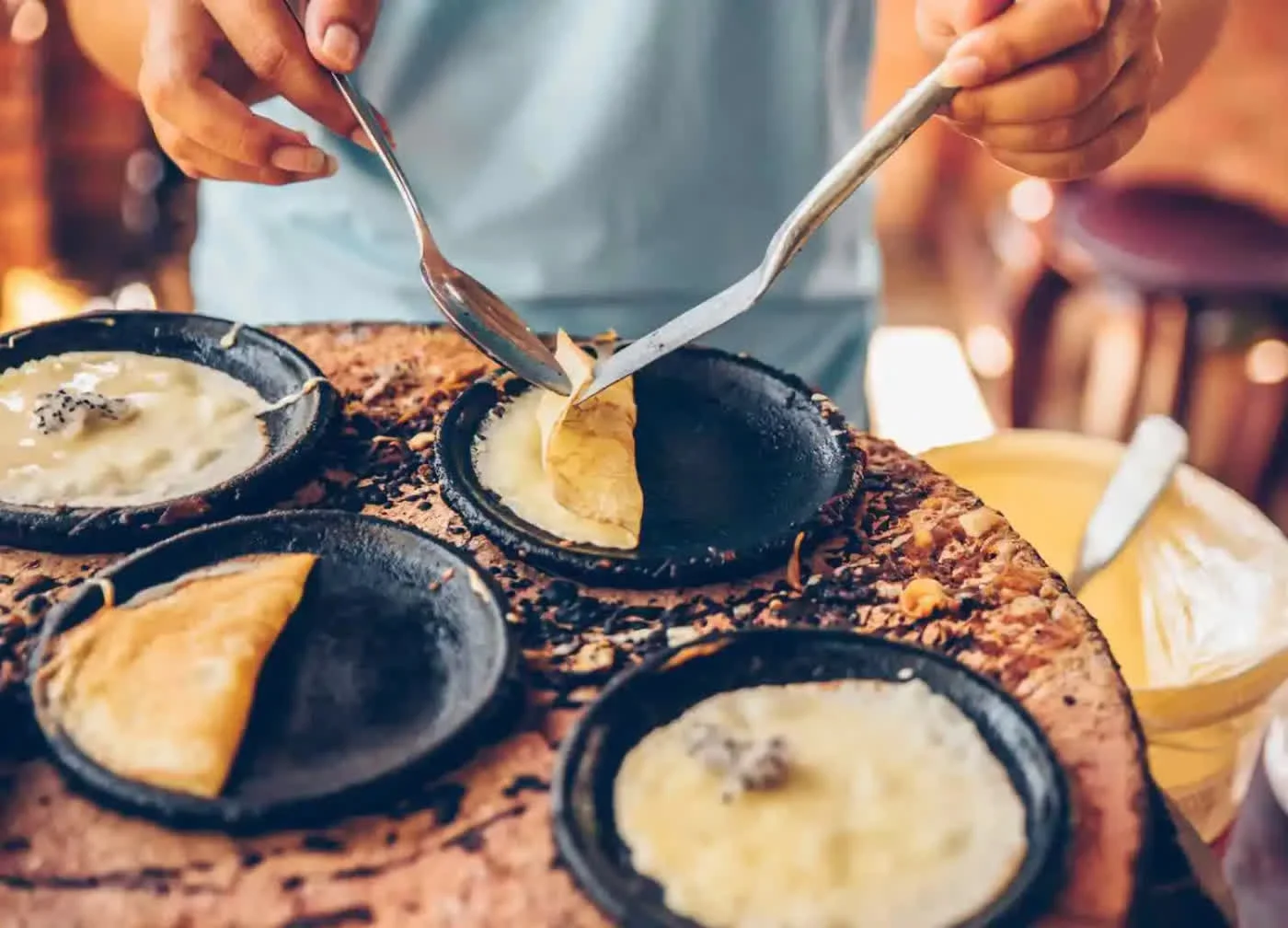 Rice-flour pancakes cooked by hand on clay griddles