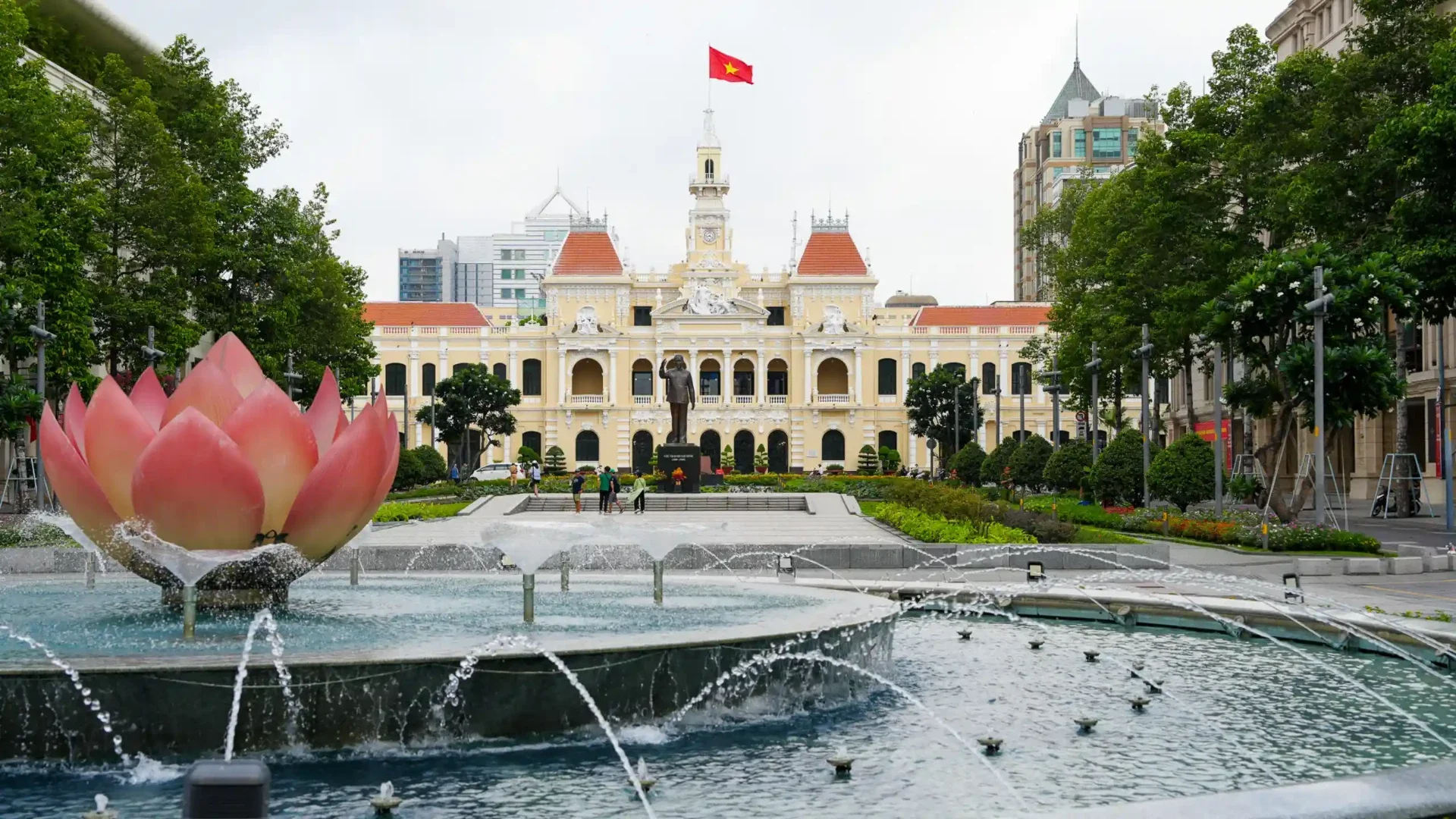 Ho Chi Minh City Hall seen across a lotus fountain